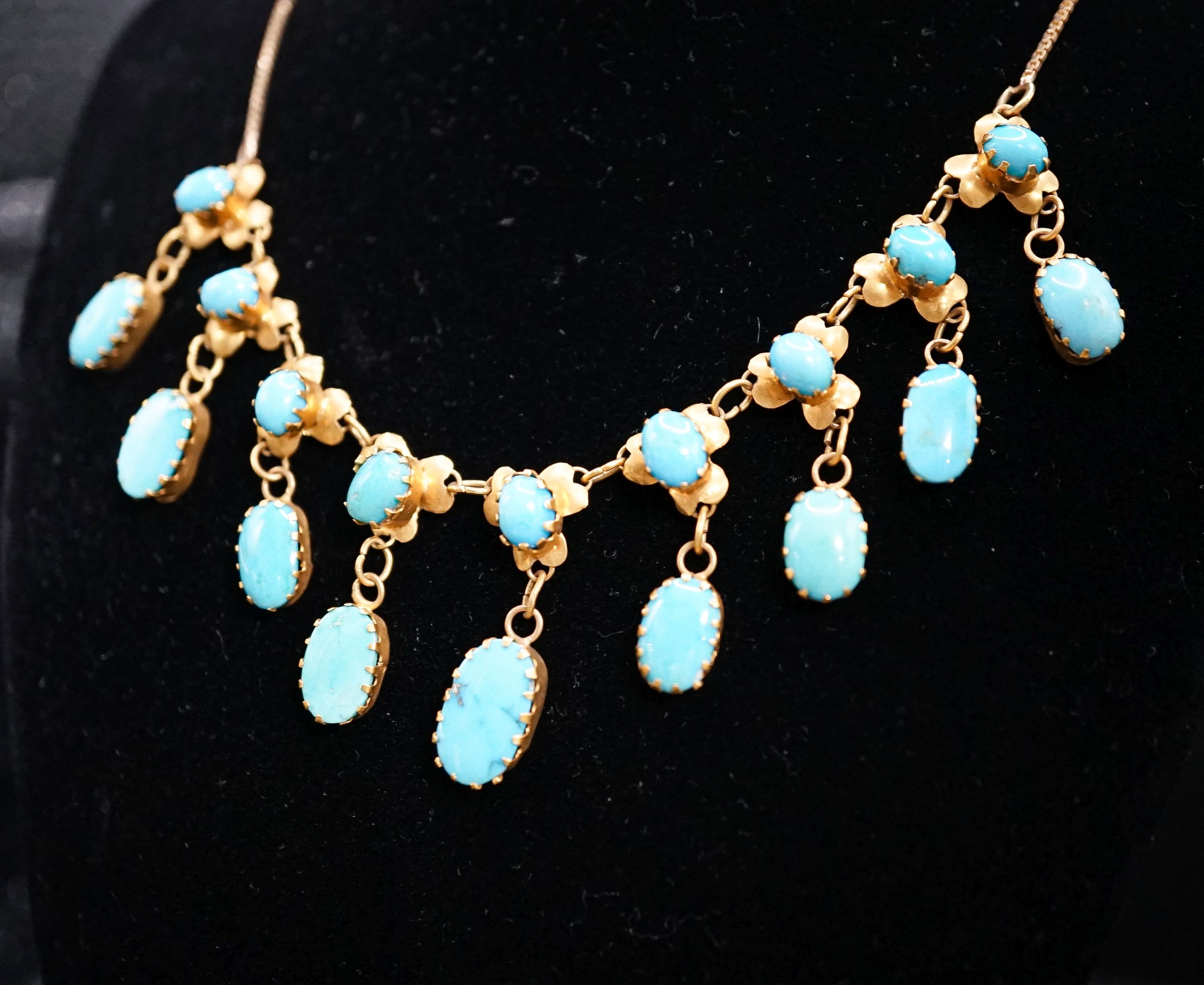 A 9k yellow metal and turquoise set drop fringe necklace, 43cm, gross 11.9 grams.